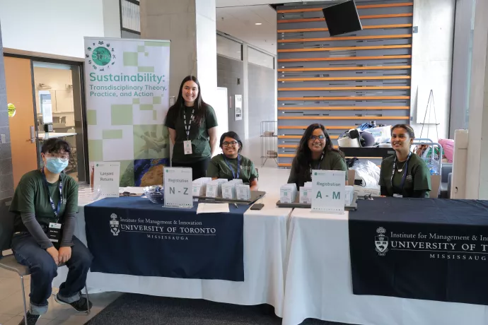 Group of students at the sustainability tables
