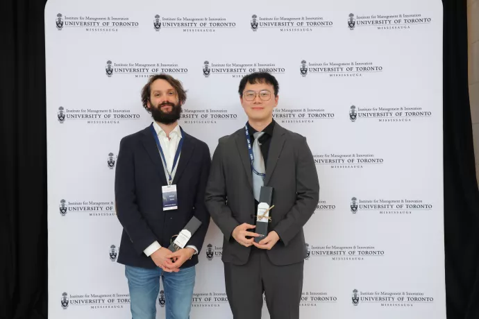 two men winning an award for artificial intelligence