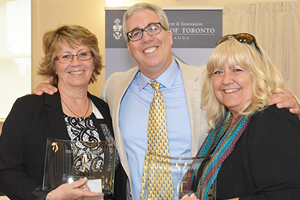 Carol Solonenko and Debby Keown with their IMI awards presented by Pierre Desrochers