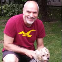 Photo of Dr. deBraga and his dog Charlie