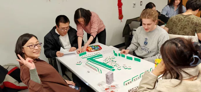 Mahjong playing team