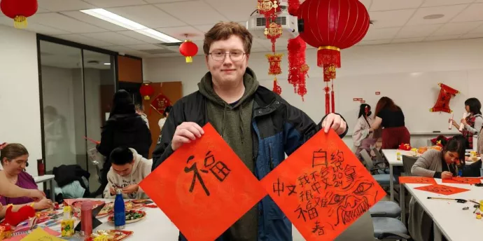 Student showcases his calligraphy work