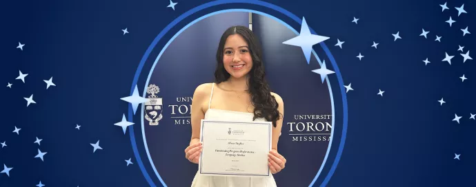 Alison wins award against blue background with stars