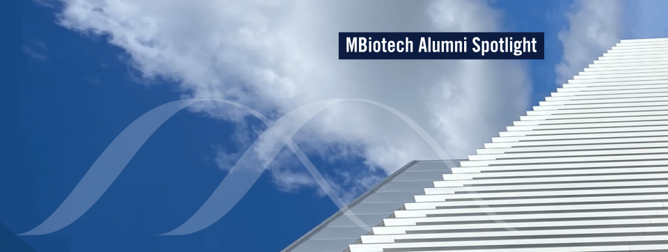 MBiotech Alumni Spotlight | logo over sky and Innovation Complex