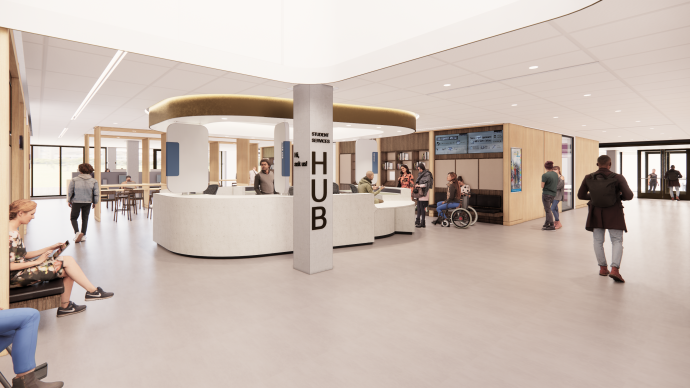 Student Services Hub reception desk with resource area in background and students walking by.