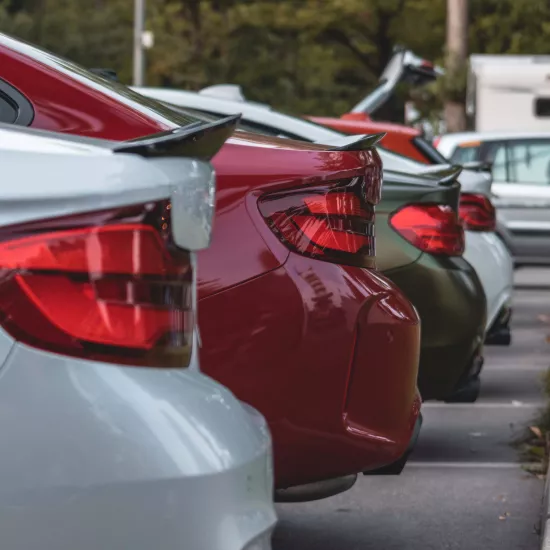 Cars parked next to each other. Photo by Christian Wiediger on Unsplash