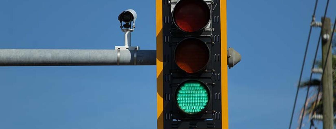Green traffic light against a blue sky. Photo by Eliobed Suarez on Unsplash