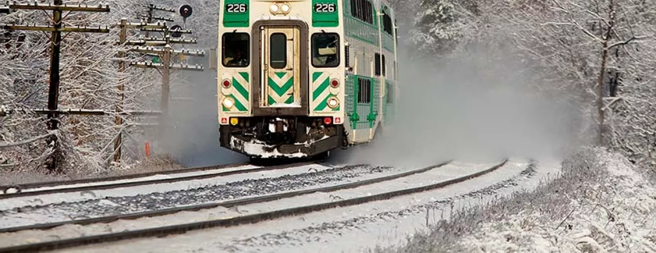 GO train on a snowy winter day. Photo by John McArthur on Unsplash