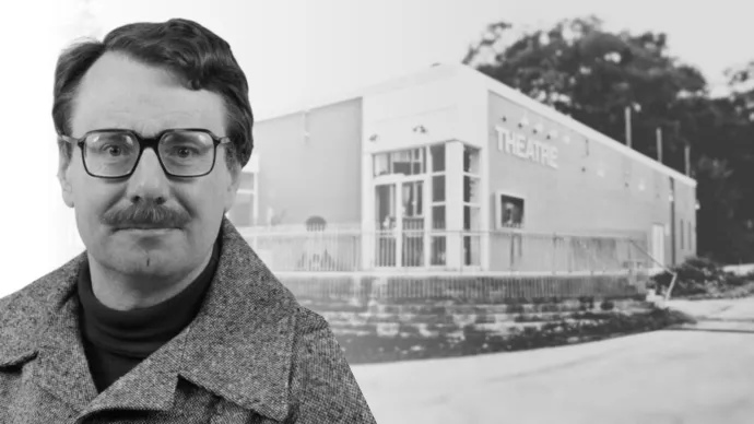 Roger Beck in an undated photo, with Theatre Erindale in the background