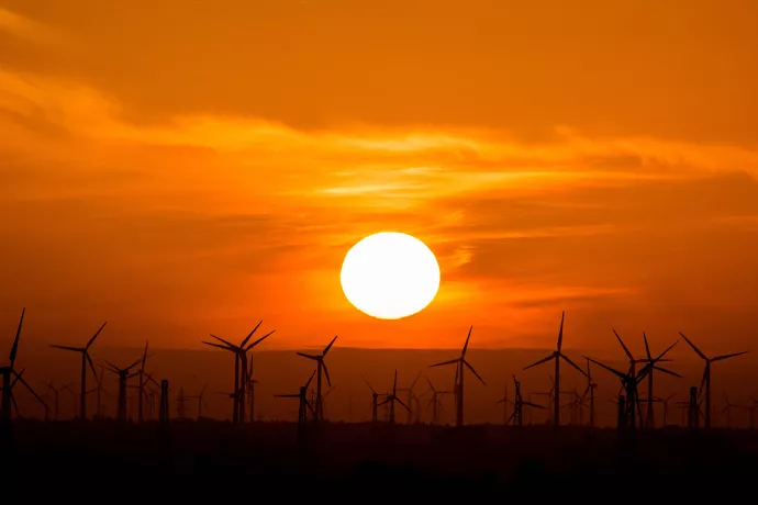 Sunset with wind turbines in the foreground