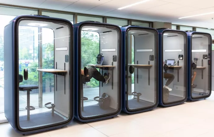 The self-contained pods feature an ergonomic seating area for one, charging ports, a desk and a large, clear door that blocks out sounds outside.