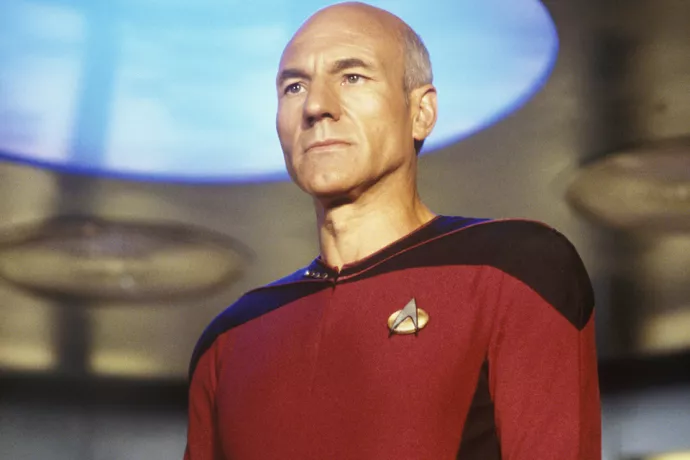 Star Trek's Jean-Luc Picard stands on the transporter pad