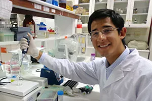 UTM science student Gustavo Gutierrez working in the lab. 