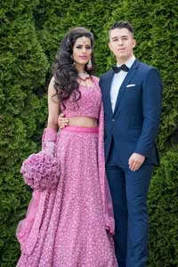 Puneet Kohli and Imre Gams pose in their wedding attire.