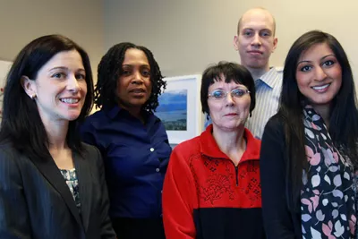 (Left to right): Andrea Carter, Sandra Carnegie-Douglas, Marilou Thompson, Justin Charles and Tricia Patel are among the equity office staff members who ensure that U of T's policies are inclusive and equitable. (Photo by Caz Zyvatkauskas)