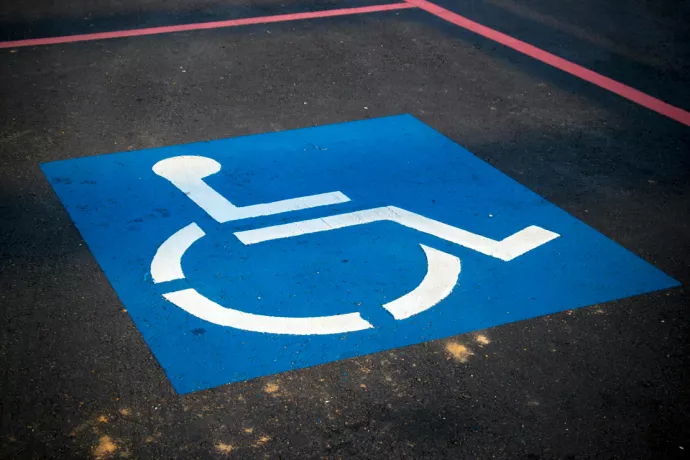 Parking spot with wheelchair symbol painted on it