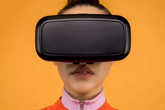 Close up of woman wearing black VR goggle headset