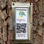 metal tag with black and white QR code