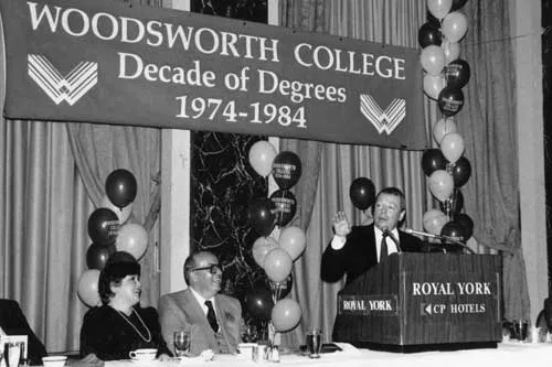 Peter Silcox looks on as Toronto mayor David Crombie speaks at the tenth anniversary celebrations for Woodsworth College.