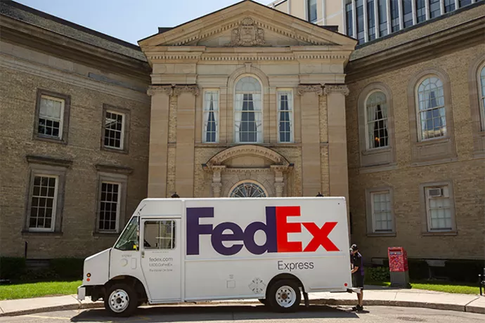 FedEx truck sitting outside campus building