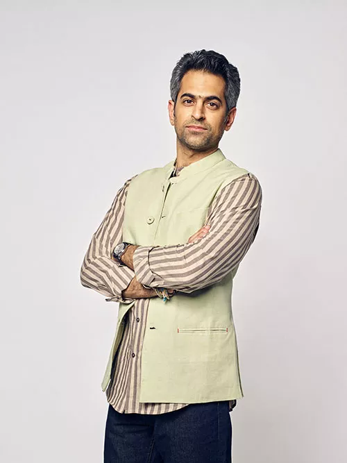 Richie Mehta standing looking at camera with arms crossed
