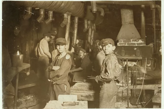 Young boys in old factory, black and white photo
