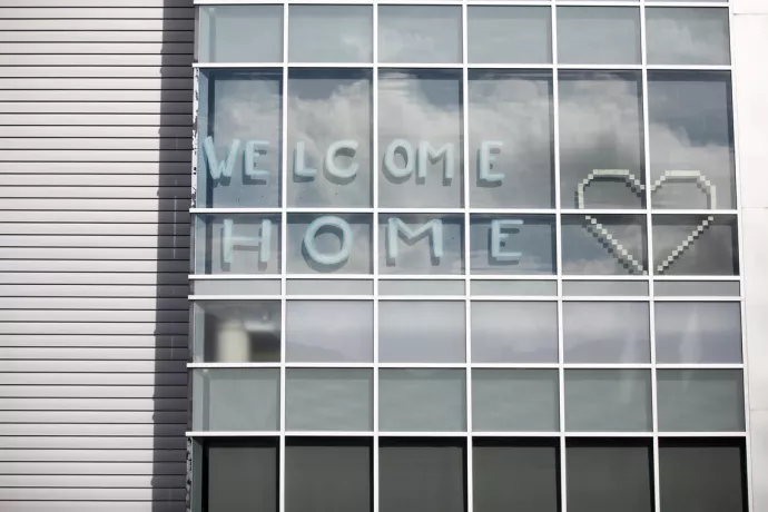 Welcome Home sign on residence window
