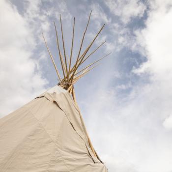 The tipi on UTM campus is seen on a partly cloudy day