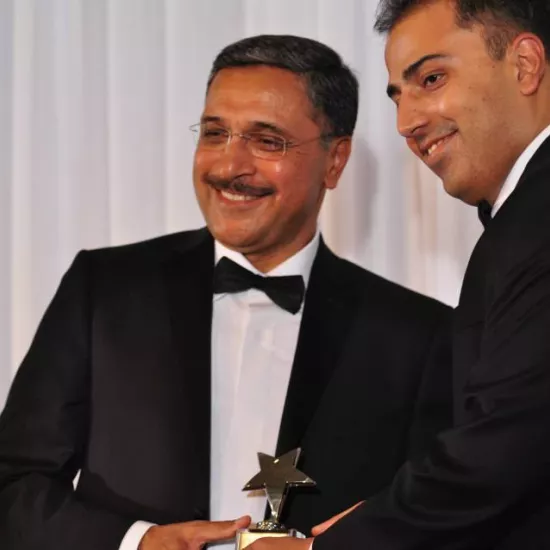 Deep Saini accepts an award