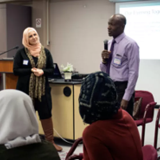 Emmanuel Nikiema speaks to Syrian refugees in Faculty Club at UTM