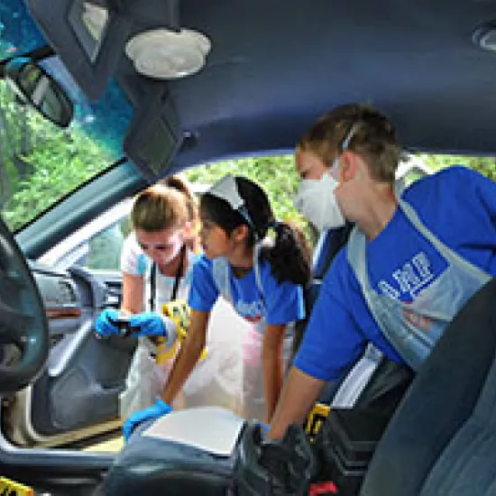 Children investigating the interior of a car