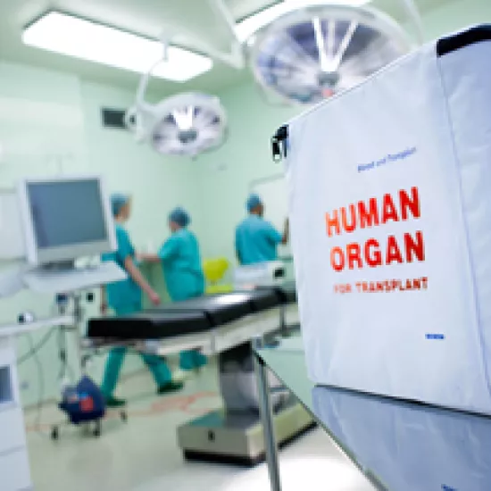 hospital operating room and white organ donation box with red lettering