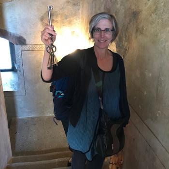  Photo of Jill Caskey holding the keys to the castle—Karlštejn Castle in the Czech Republic.