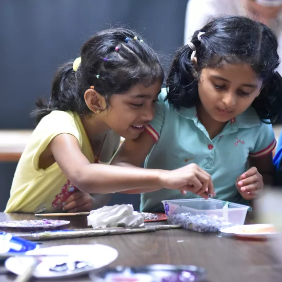 Photo of two children doing arts and crafts at Camp UofT