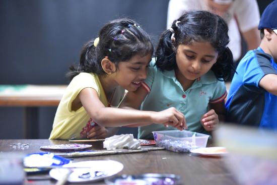 Photo of two children doing arts and crafts at Camp UofT