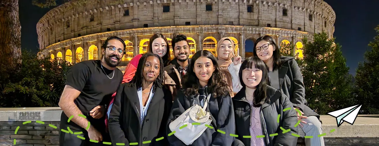 Students posing in front of the Colliseum in Rome, Italy