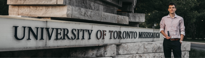 Image of student in front of University of Toronto Mississauga sign