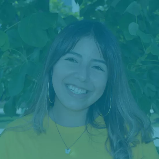 picture of student smiling in a yellow shirt