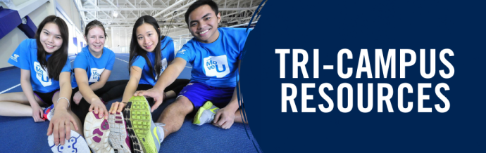 Four students stretching on an indoor running track. "Tri-Campus Resources".