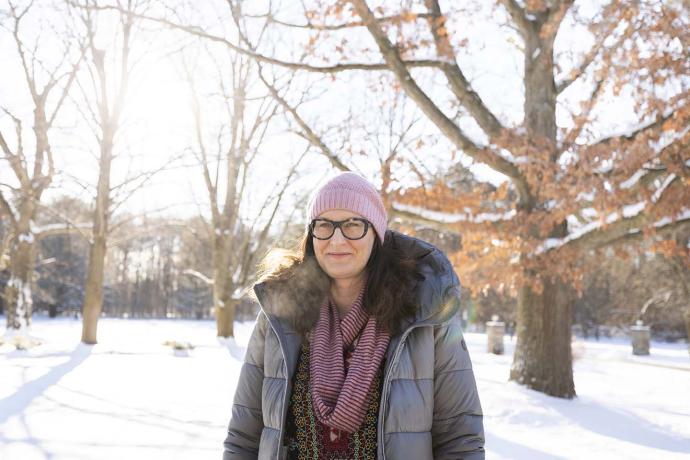 Alexandra Gillespie standing outside on the UTM campus, surrounded by snow