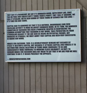 Billboard with excerpt of Wages for Facebook manifesto
