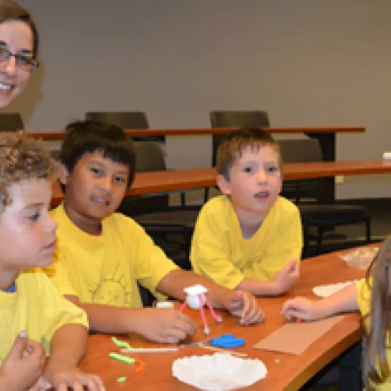 Jenna Friedt (in blue) with camp kids from Sunshine Children's Centre